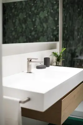 a white sink in a bathroom with a window at Studio Margherita in Rome