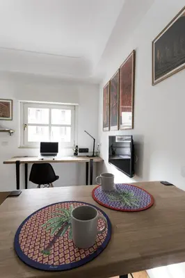 a table with two cups on it in a room at Studio Margherita in Rome