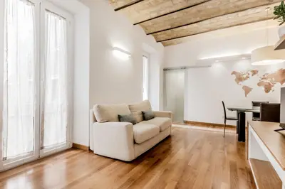 a living room with a couch and a table at Trastevere House 24 in Rome