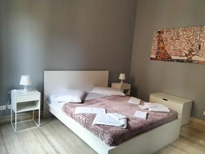 a bedroom with a bed with towels on it at OLD BAKERY TWO BED ROOM APARTMENT in Rome