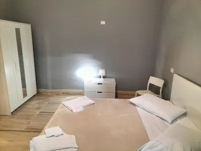 a bedroom with a bed with two towels on it at OLD BAKERY TWO BED ROOM APARTMENT in Rome