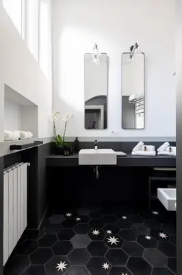 a bathroom with two sinks and two mirrors at Trastevere Charming Rosa Apartment in Rome