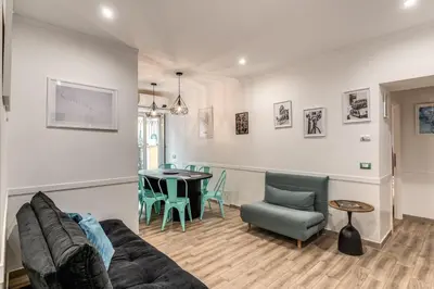 a living room with a couch and a table at Kira Luxury Apartment with terrace in Rome