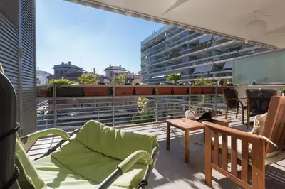 a balcony with chairs and a table on a building at Boutique Domus River Terrace in Rome