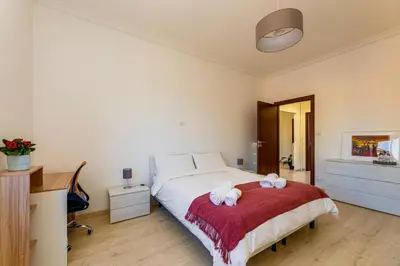 a bedroom with a bed with two towels on it at Italia Room vicino Stazione Termini in Rome