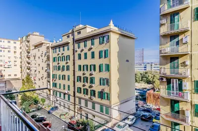 an apartment building in a city with buildings at Sweethome Marconi in Rome