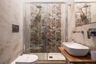 a bathroom with a shower and a sink and a toilet at Affittacamere Casalí in Rome