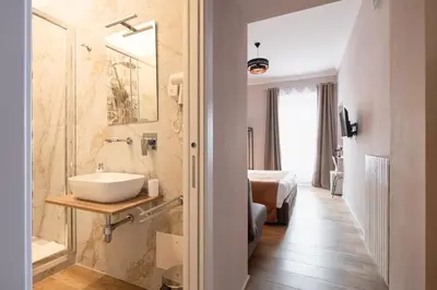 a bathroom with a sink and a shower at Affittacamere Casalí in Rome