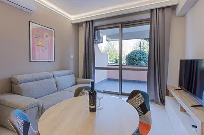 a living room with a table and a couch at Aurelia Boutique Apartment in Rome