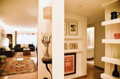 a living room with a fireplace and a couch at Chic and Elegant Apartment in the heart of Rome in Rome