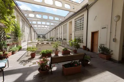 a greenhouse with potted plants in a building at Poetico Monolocale Indipendente nell’Antico Pastificio in Rome