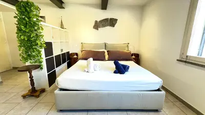 a bedroom with a bed with two stuffed animals on it at Poetico Monolocale Indipendente nell’Antico Pastificio in Rome