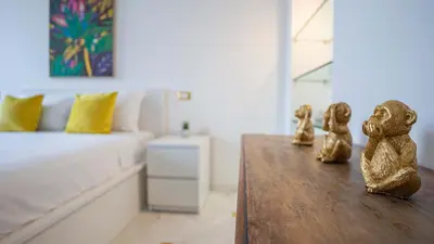 a room with a table with two figurines on it at EasyTopStay - Colonna Guest House in Rome