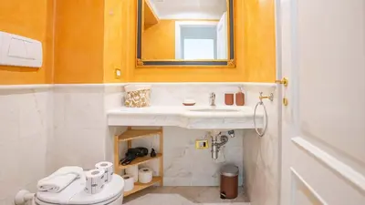 a bathroom with a sink and a toilet at EasyTopStay - Colonna Guest House in Rome