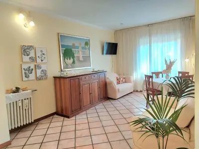 a living room with a couch a chair and a tv at Pigneto Happy Stay in Rome