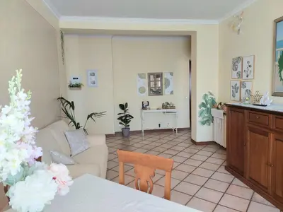 a living room with a couch and a table at Pigneto Happy Stay in Rome