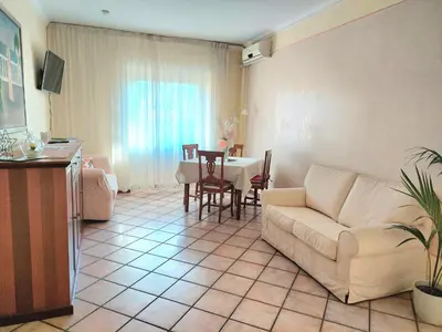 a living room with a couch and a table at Pigneto Happy Stay in Rome