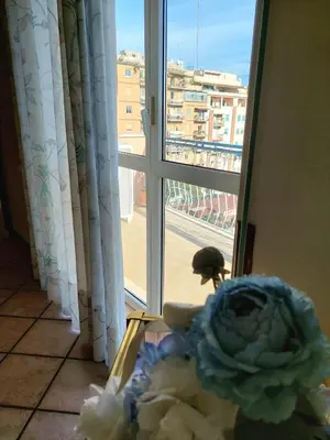 a room with a window with a view of a city at Pigneto Happy Stay in Rome