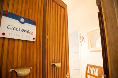 a sign on the wall of a room at Cicerone 60 in Rome