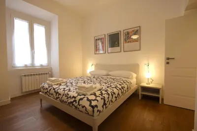 a bedroom with a bed and a window at Risorgimento Holiday Home in Rome
