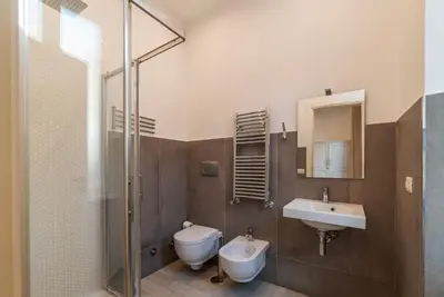 a bathroom with a toilet and a sink and a shower at Major 93 Guesthouse in Rome