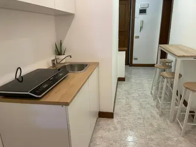 a kitchen with a sink and a counter top at Blue Vatican House in Rome