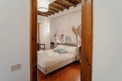 a bedroom with a bed in a room at La Maisonette di Trastevere in Rome