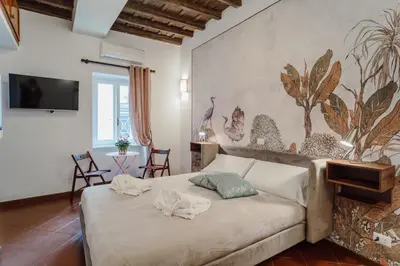 a bedroom with a bed with towels on it at La Maisonette di Trastevere in Rome