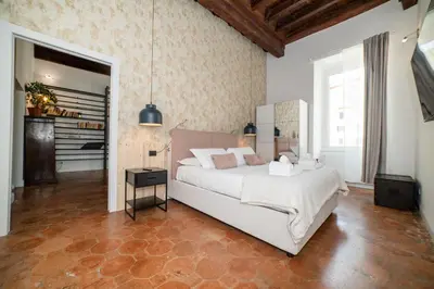 a bedroom with a large bed in a room at Campo De Fiori Home in Rome