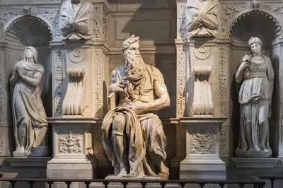 a statue in front of a building with statues at DOMUS LAURA Rione MONTI in Rome