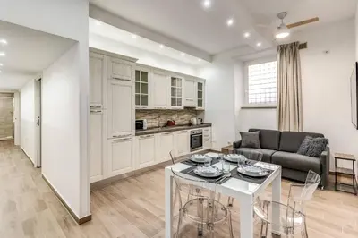 a living room with a couch and a table at New flat in front StPeter Square in Rome