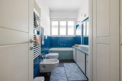 a bathroom with a toilet and a sink and a tub at [CASA LUCIA 5 stelle] Lungotevere della Vittoria in Rome
