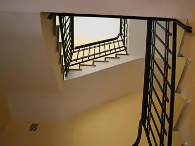 a spiral staircase in a room with a window at Top Floor Navona in Rome