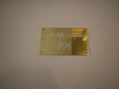 a sign on a wall that says i indo talia cantina at Top Floor Navona in Rome