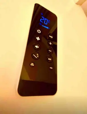 a remote control sitting on top of a table at Vacanze Romane al Portico d'Ottavia in Rome