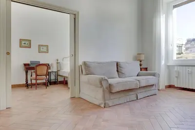 a living room with a couch and a table at Home and More St. Angelo APT 5 in Rome