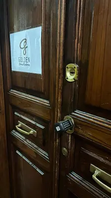 a wooden door with a sign on it at Golden Luxury Home - San Giovanni - 3 min to Colosseum in Rome