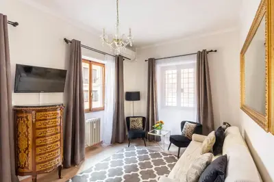 a living room with a couch and a tv at Navona Home in Rome