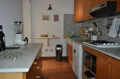 a kitchen with a counter and a stove top oven at ROME FOR TWO Campo de' Fiori - your home in Rome in Rome