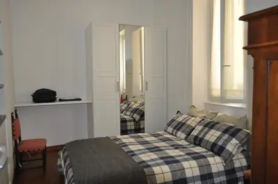 a bedroom with a bed and a mirror at ROME FOR TWO Campo de' Fiori - your home in Rome in Rome