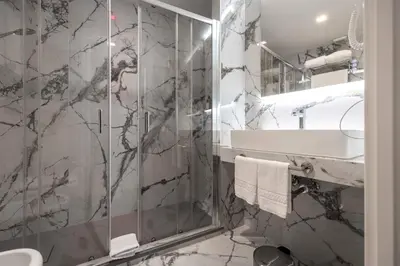 a bathroom with a shower and a sink at Home at Rome Luxury Navona Guest House 2 in Rome