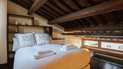 a bedroom with a bed with towels on it at EasyTopStay - Piazza Venezia City View Charming Apt in Rome