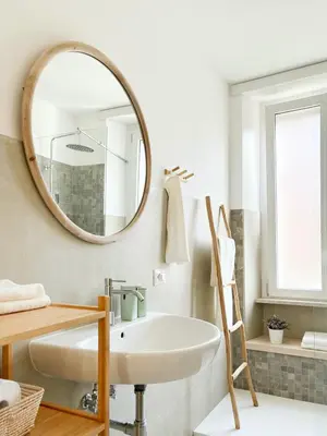 a bathroom with a white sink and a mirror at Grazioso appartamento al Pigneto in Rome