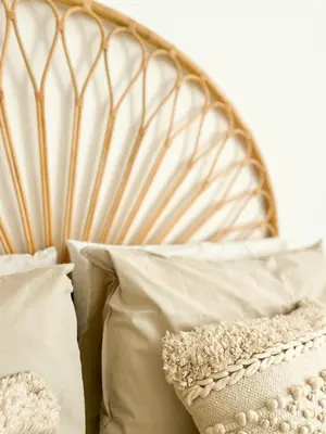 a bed with white pillows and a wooden headboard at Grazioso appartamento al Pigneto in Rome
