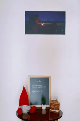 a santa hat sitting on a table with a picture at Villa Fiorelli rooms in Rome