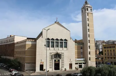 a large building with a clock tower in a city at Appartamento 5 stelle in Piazza Asti - Re di Roma - in Rome