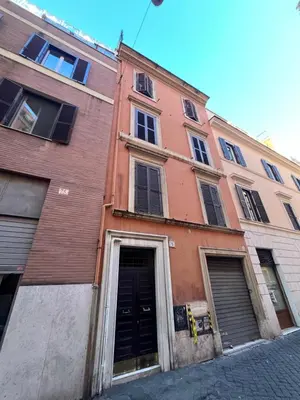 a building on a street with its door open at Civitas Leonina Apartment in Rome