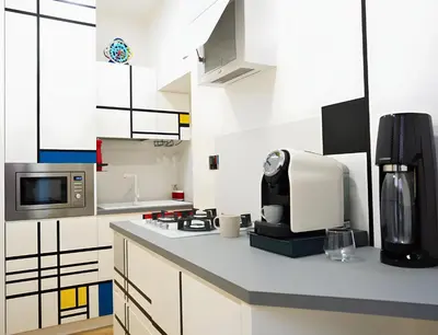 a kitchen with a microwave and a coffee maker on a counter at The Best Nest - Home Suite Home NEW OPENING in Rome