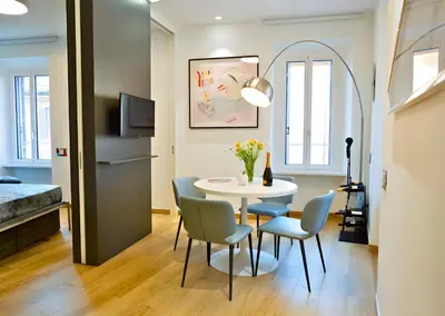 a small dining room with a table and chairs at The Best Nest - Home Suite Home NEW OPENING in Rome