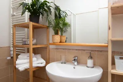 a bathroom with a sink and a mirror at Mia Ginger, Stazione Trastevere vicinanze in Rome